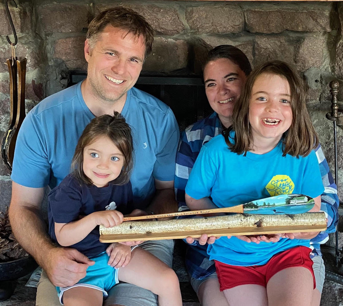 Chase Miller and family, the lucky winners of a John Miller III handcrafted loon  paddle. All participants in TILT’s annual loon census are eligible to win.