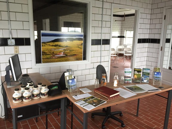 Welcome center with desk, brochures, maple syrup
