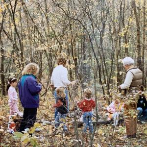 S. Gerald Ingerson is joined by his children and grandchildren in the woods just south of the trestle bridge.